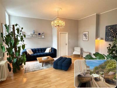 Premium Kingsize Suite - großes Wohnzimmer mit angrenzendem Wintergarten und Balkon